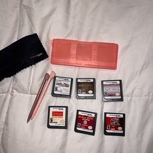6 ds games, with 2 stylus, a case, and cloth for cleaning